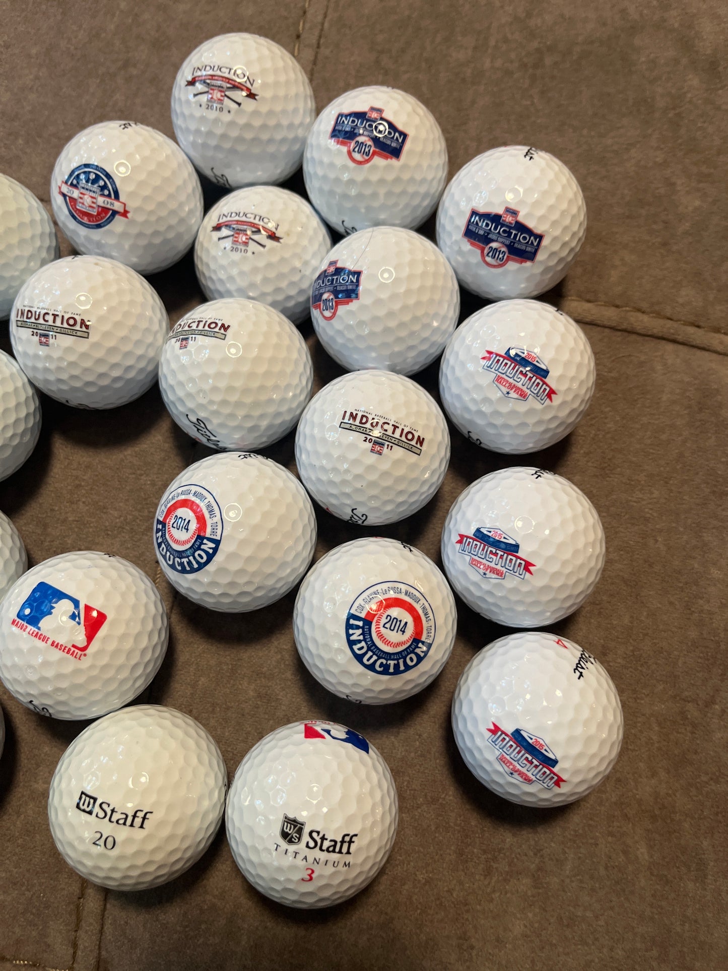 24 golf balls, 14 Hall of Fame, 5 St. Louis Cardinals, 3 major-league baseball and 2 Lou Brock