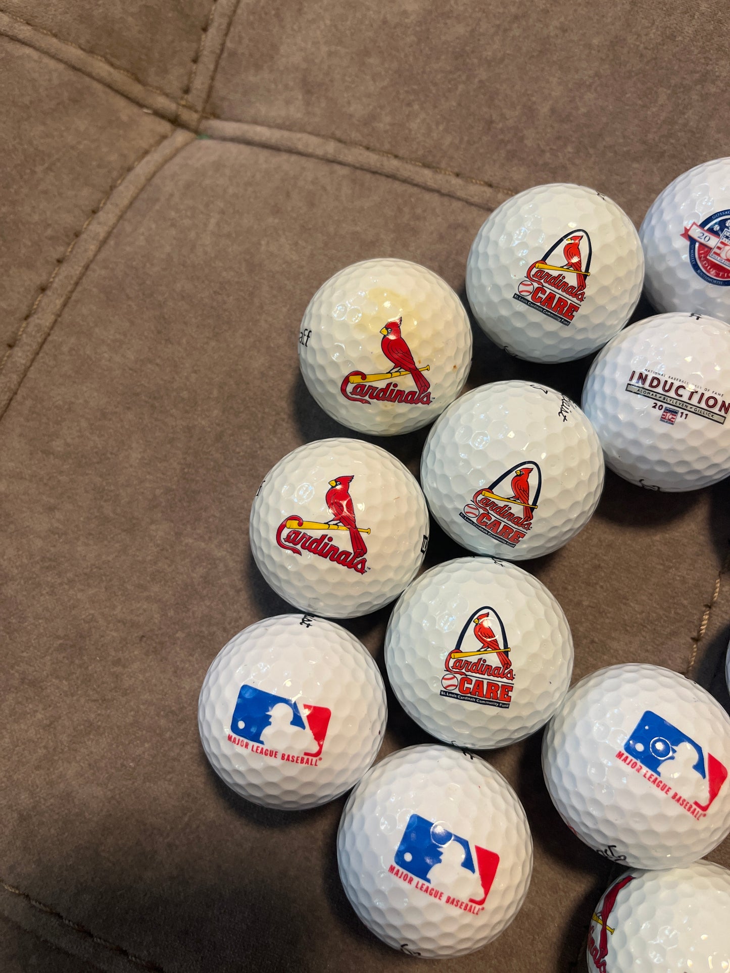 24 golf balls, 14 Hall of Fame, 5 St. Louis Cardinals, 3 major-league baseball and 2 Lou Brock