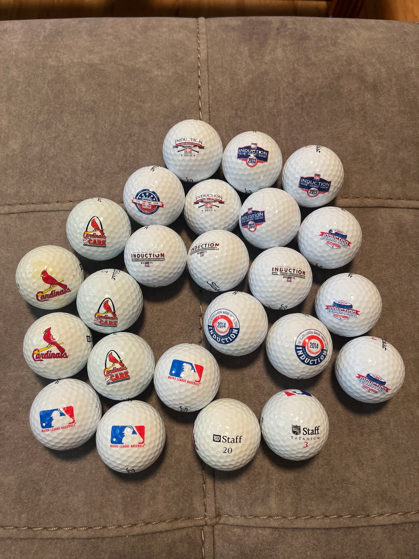 24 golf balls, 14 Hall of Fame, 5 St. Louis Cardinals, 3 major-league baseball and 2 Lou Brock