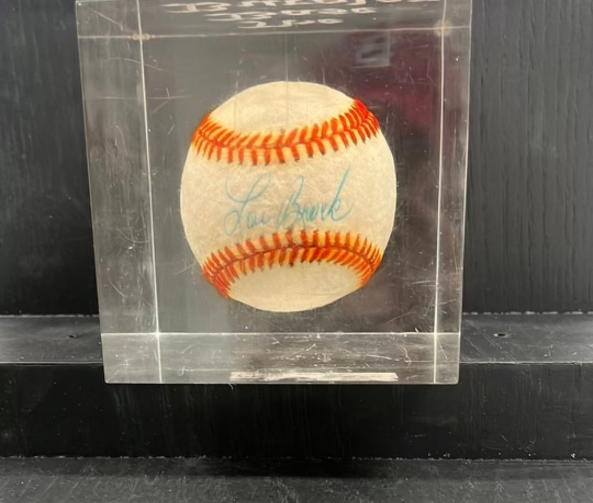 Encased bass burglar signed Lou Brock baseball