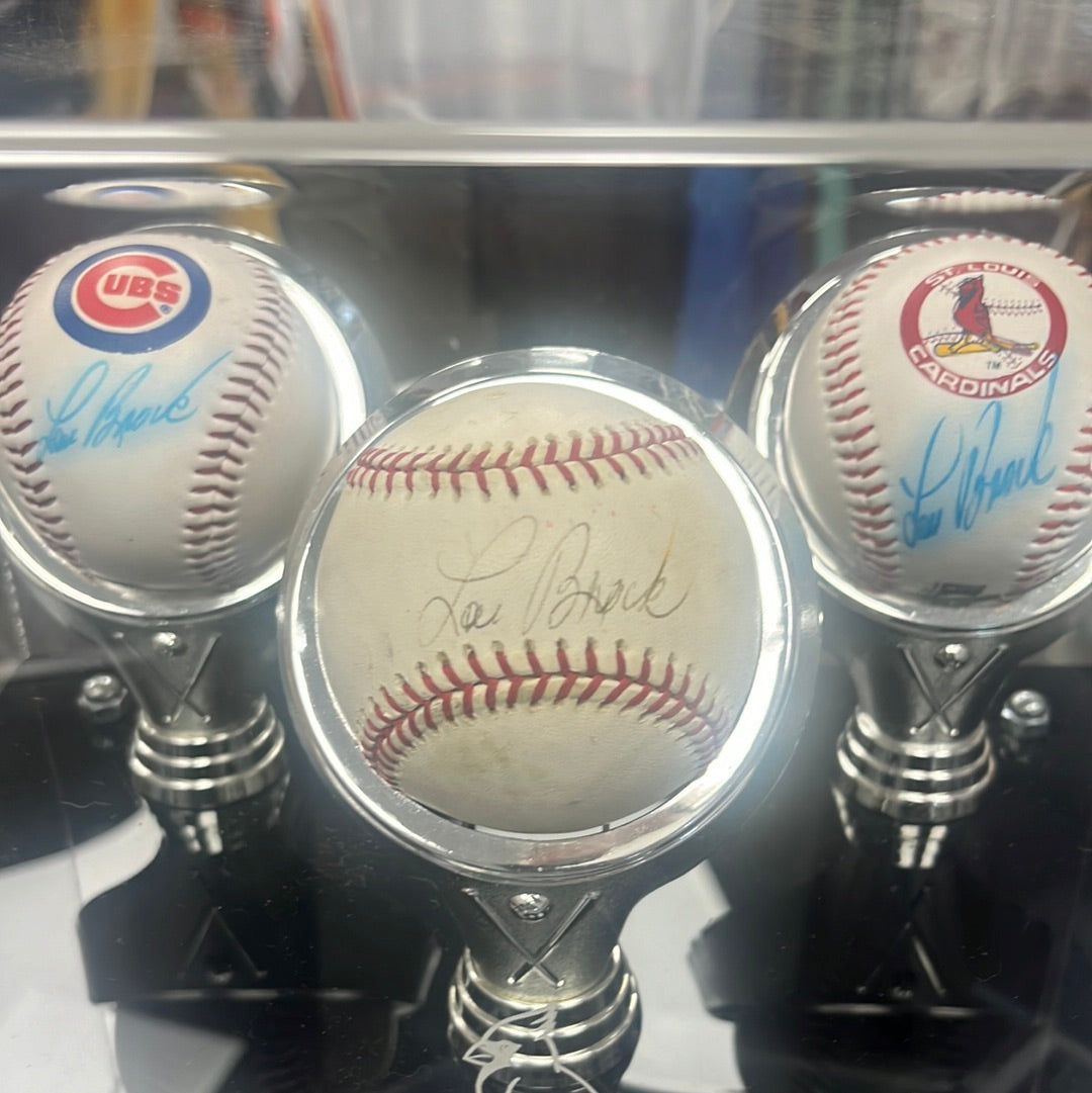 Three Lou Brock, signed balls and Cardinals blue rock Hall of Fame 1985 case