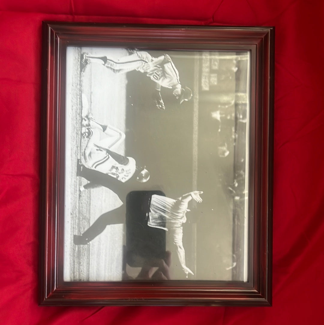 8 x 10” photo of Lou Brock stealing the record-breaking base