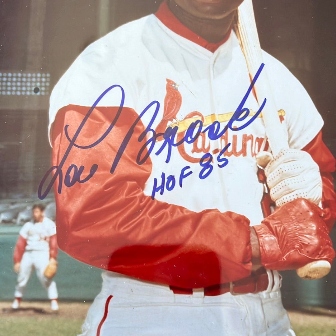 8 x 10” photo signed by Lou Brock with Hall of Fame inscription