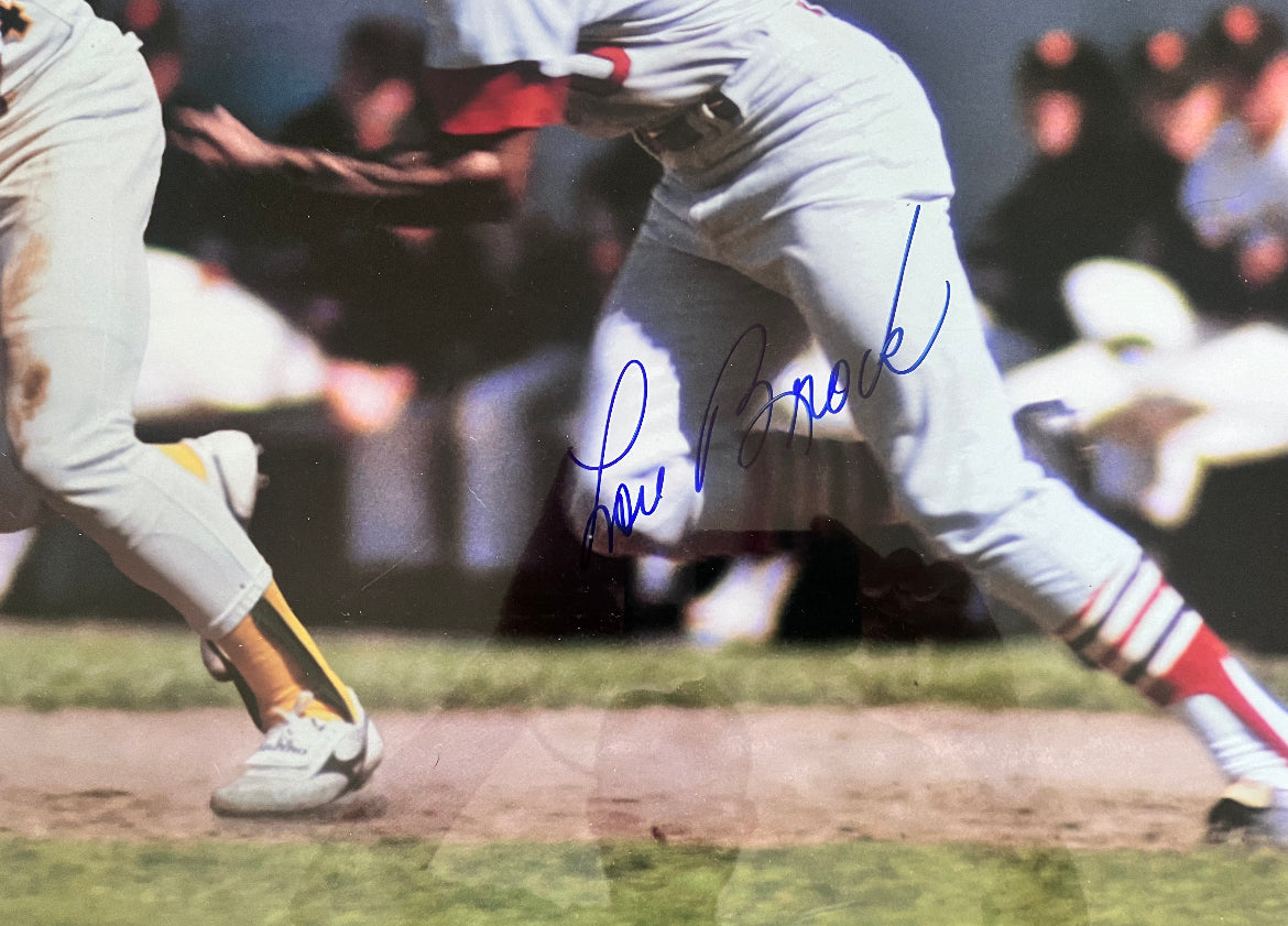 Signed Lou Brock and Rickey Henderson sports illustrated record breaking poster from 1989 from the personal collection of Lou Brock