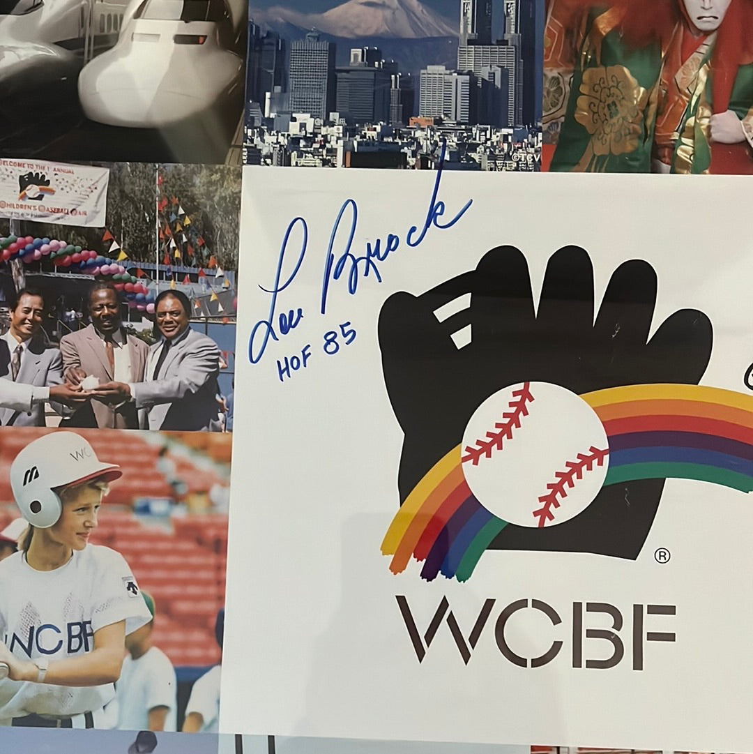 20 x 30“ WCBF world children’s baseball fair poster, signed by Lou Brock and two plaques presented to Lou Brock