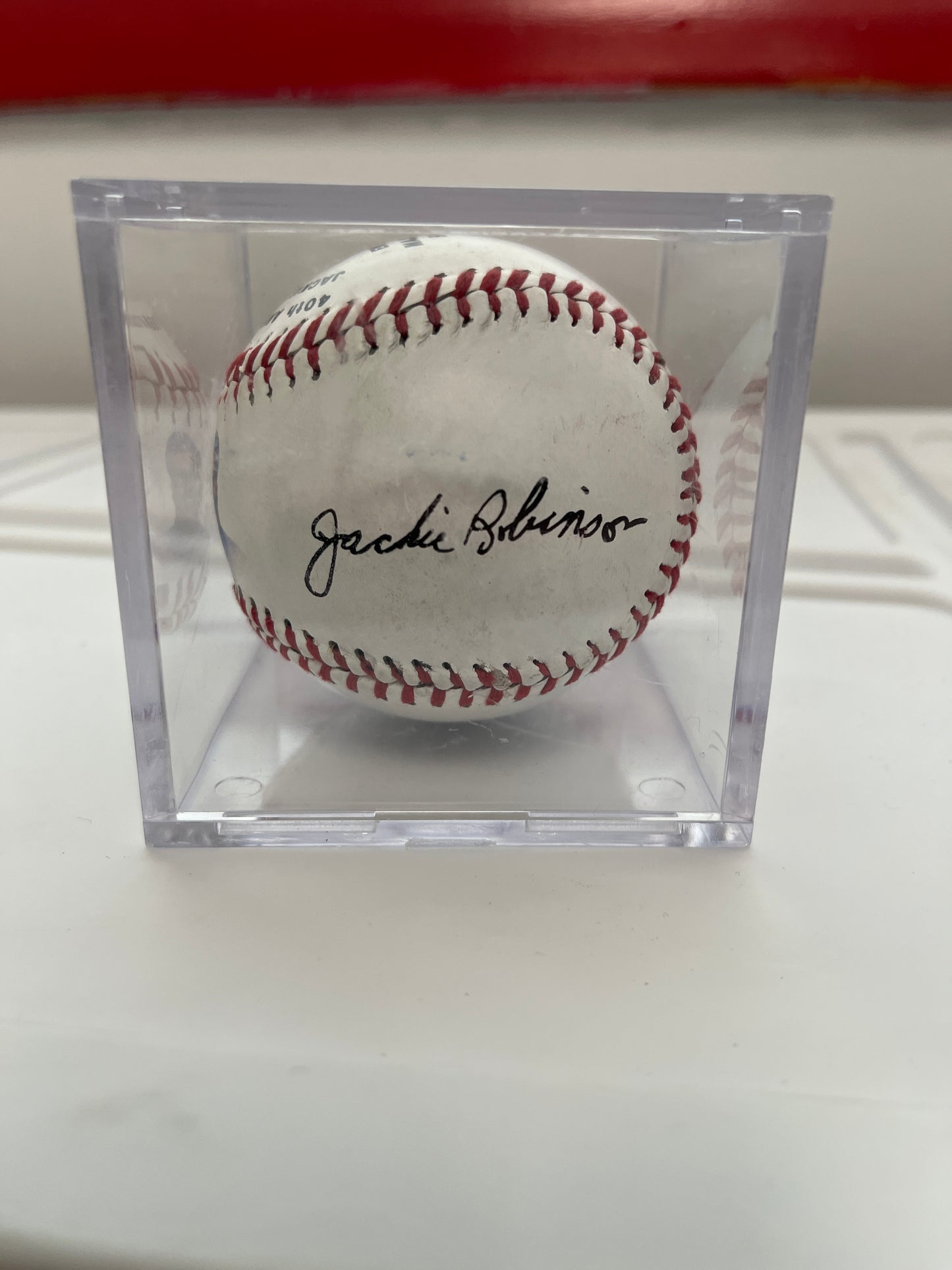 Pete Rose salutes Jackie Robinson commemorative ball