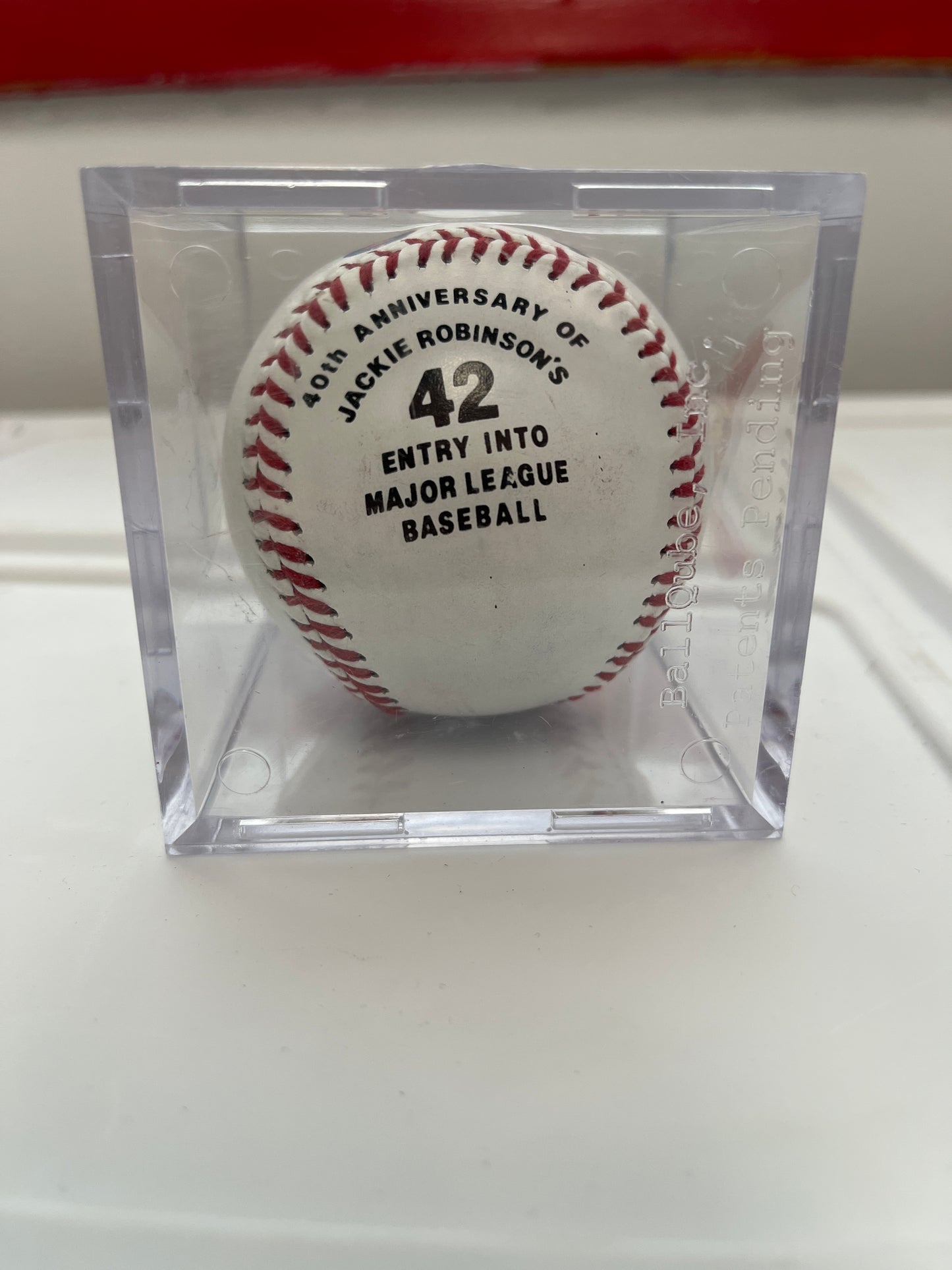 Pete Rose salutes Jackie Robinson commemorative ball