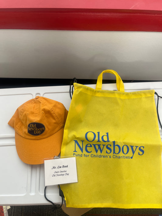 Lou Brock's name tag And hat from old newsboys day including bag