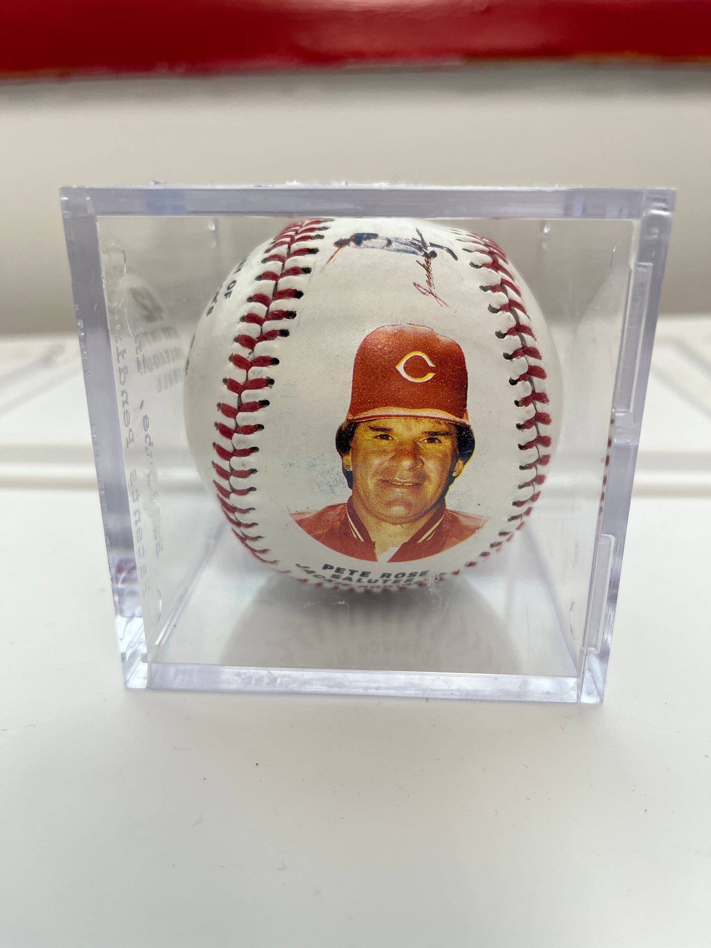 Pete Rose salutes Jackie Robinson commemorative ball