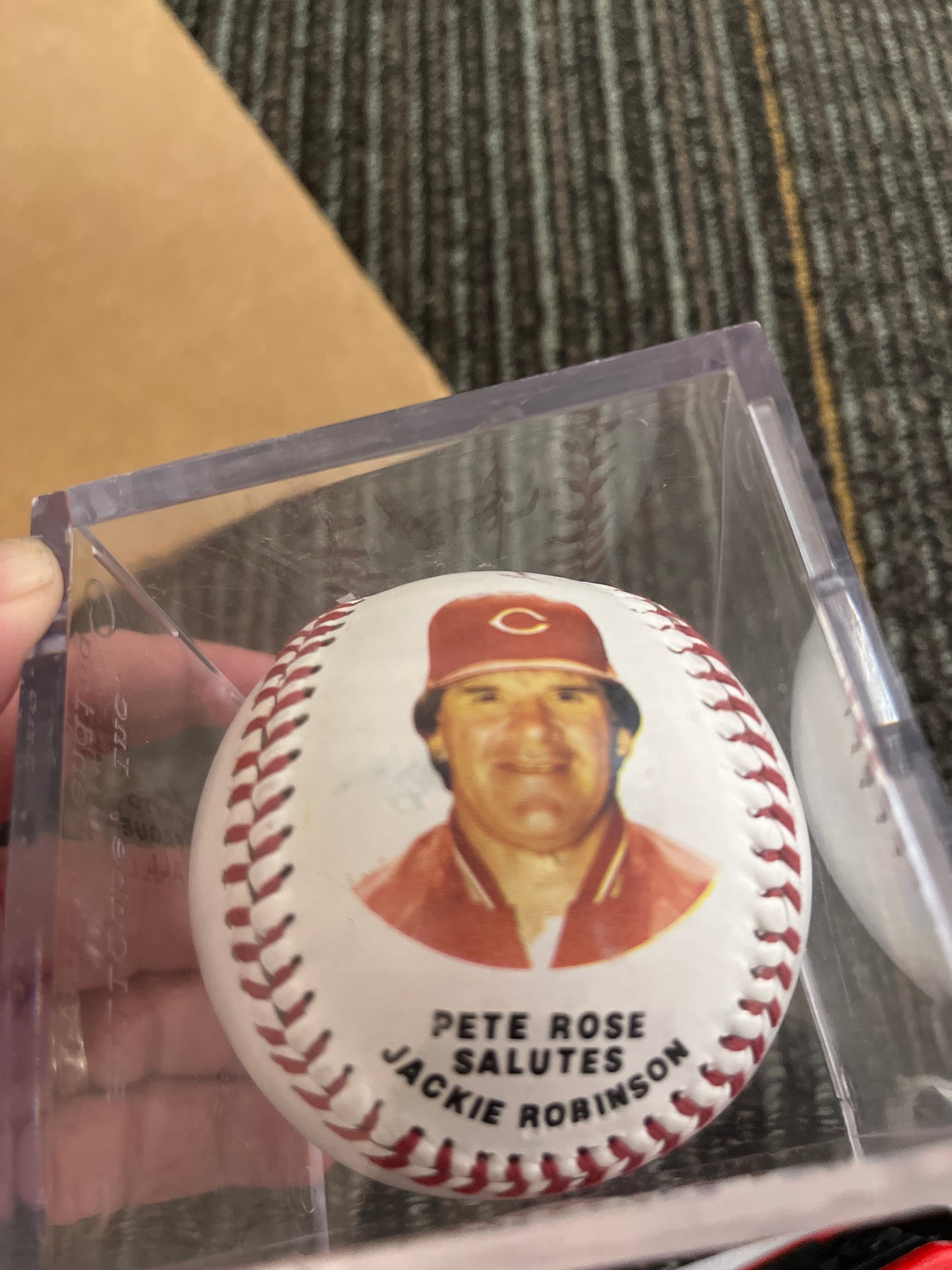 Pete Rose salutes Jackie Robinson commemorative ball